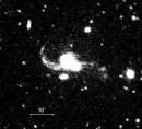 Detección de un Cuásar Binario Dentro de un Par de Galaxias en Plena Fusión